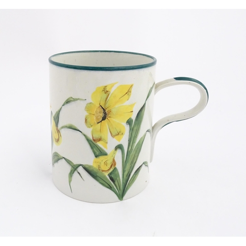 115 - A Wemyss tankard / mug with hand painted daffodil flowers and green detail to rim and handle. Impres... 