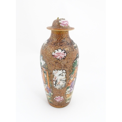 12 - A Chinese famille rose vase and cover decorated in the Mandarin pattern, with vignettes depicting fi... 