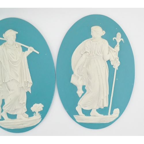 121 - Four Wedgwood Jasperware style plaques of oval form depicting Classical ladies. Approx. 12 1/2