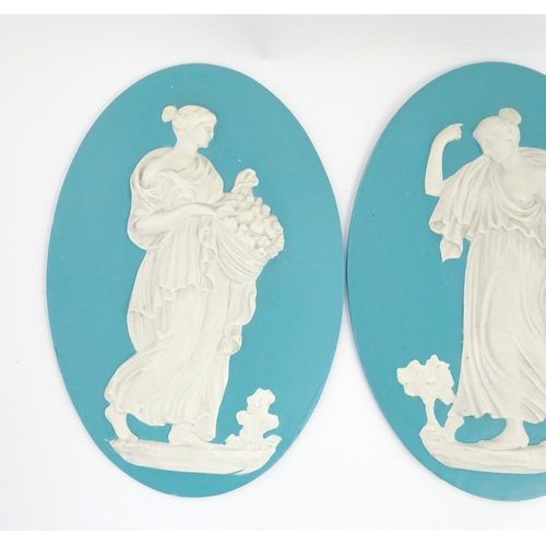 121 - Four Wedgwood Jasperware style plaques of oval form depicting Classical ladies. Approx. 12 1/2