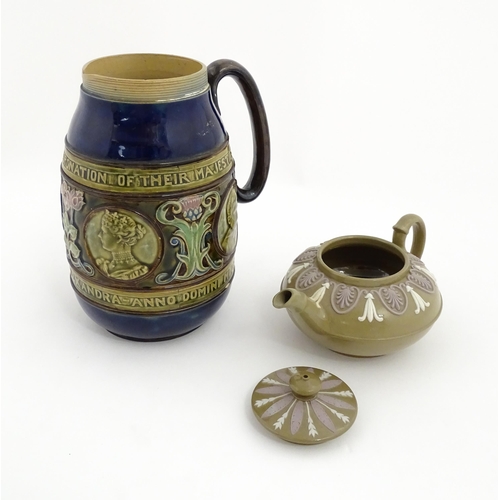 123 - A small Wedgwood stoneware teapot with relief banded decoration. Together with a Doulton Lambeth jug... 