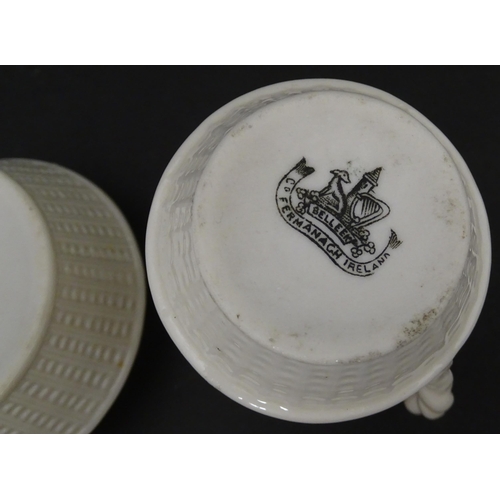 124 - A Belleek sugar bowl and milk jug with banded decoration. Marked under. Jug approx. 3 1/2