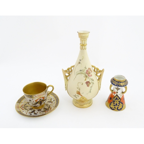 128 - A Royal Worcester blush ivory vase with twin handles of shaped form decorated with flowers and folia... 