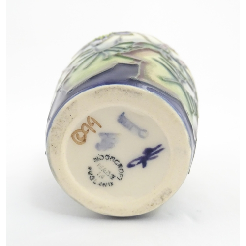 132 - A small Moorcroft vase decorated in the Hepatica pattern, designed by Emma Bossons. Marked under. Ap... 