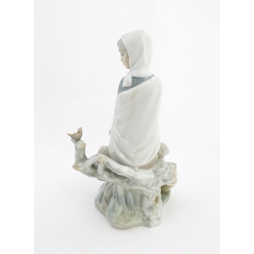 135 - A Lladro model New Shepherdess, depicting a woman watching a bird, model no. 4576. Marked under. App... 