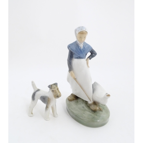 139 - Two Royal Copenhagen models to include a Fox Terrier dog, model no. 3170, and Girl with Goose, model... 