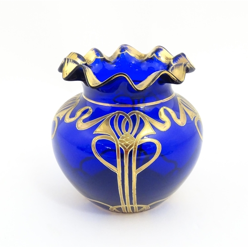 160 - An Art Nouveau blue glass vase with gilded detail, possibly by Moser. Approx. 5 1/4