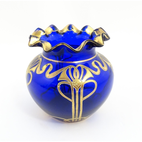 160 - An Art Nouveau blue glass vase with gilded detail, possibly by Moser. Approx. 5 1/4