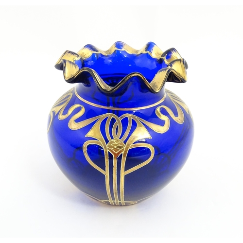 160 - An Art Nouveau blue glass vase with gilded detail, possibly by Moser. Approx. 5 1/4