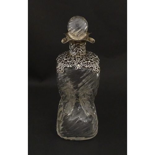 162 - A Victorian glass glug glug / pinch decanter with a pierced silver mount hallmarked London 1898, mak... 