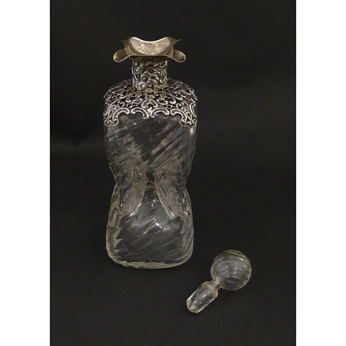 162 - A Victorian glass glug glug / pinch decanter with a pierced silver mount hallmarked London 1898, mak... 