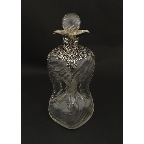 162 - A Victorian glass glug glug / pinch decanter with a pierced silver mount hallmarked London 1898, mak... 