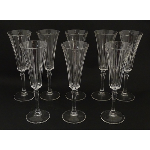 175 - A set of eight glass champagne flutes, in the Novecento pattern by Royal Crystal Rock. Approx. 9