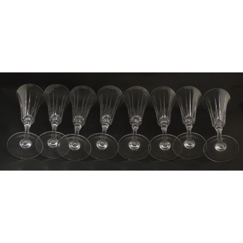 175 - A set of eight glass champagne flutes, in the Novecento pattern by Royal Crystal Rock. Approx. 9