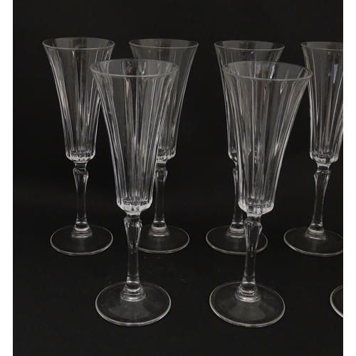 175 - A set of eight glass champagne flutes, in the Novecento pattern by Royal Crystal Rock. Approx. 9