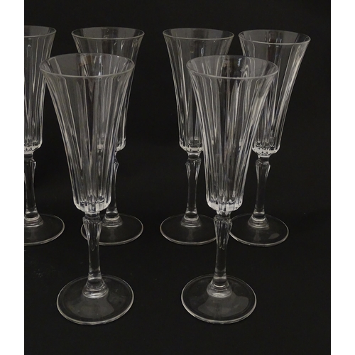 175 - A set of eight glass champagne flutes, in the Novecento pattern by Royal Crystal Rock. Approx. 9