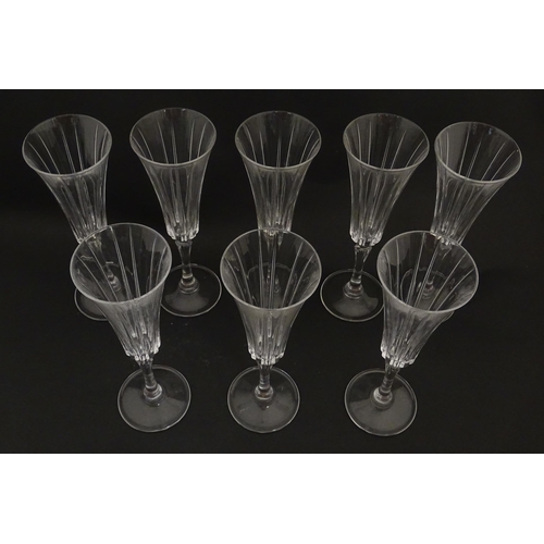 175 - A set of eight glass champagne flutes, in the Novecento pattern by Royal Crystal Rock. Approx. 9