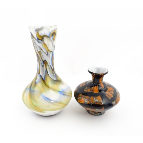 180 - Two 20thC art glass vases, one with white ground having marble detail, the other of squat form havin... 