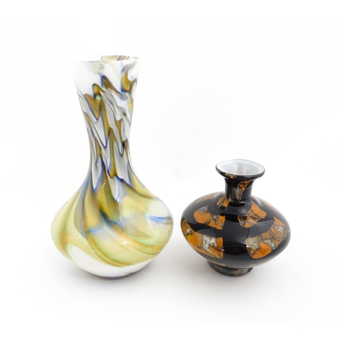 180 - Two 20thC art glass vases, one with white ground having marble detail, the other of squat form havin... 