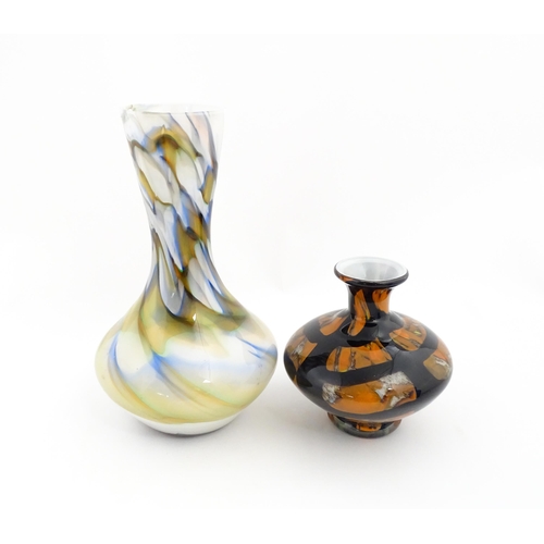 180 - Two 20thC art glass vases, one with white ground having marble detail, the other of squat form havin... 