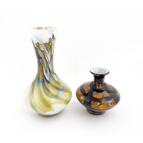 180 - Two 20thC art glass vases, one with white ground having marble detail, the other of squat form havin... 