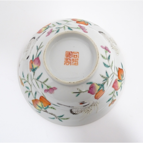 31 - Three Chinese bowls to include an example with a lobed edge decorated with a fruiting peach tree and... 