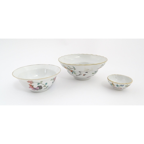 31 - Three Chinese bowls to include an example with a lobed edge decorated with a fruiting peach tree and... 