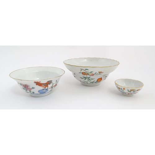 31 - Three Chinese bowls to include an example with a lobed edge decorated with a fruiting peach tree and... 