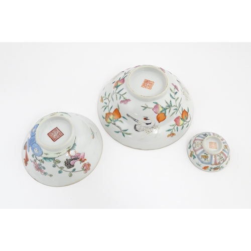 31 - Three Chinese bowls to include an example with a lobed edge decorated with a fruiting peach tree and... 