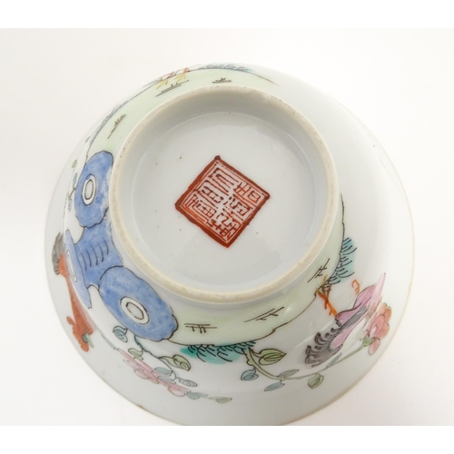 31 - Three Chinese bowls to include an example with a lobed edge decorated with a fruiting peach tree and... 