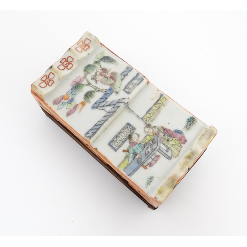 33 - A Chinese cricket box of squared form decorated with scholars in a garden landscape. Together with a... 