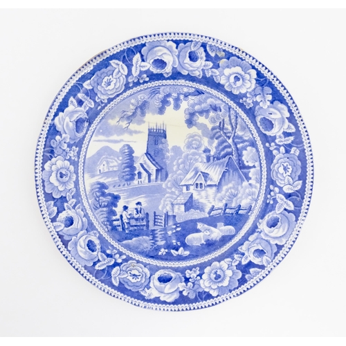 66 - A 19thC blue and white plate decorated in the Village Church pattern with dog rose border. Approx. 9... 