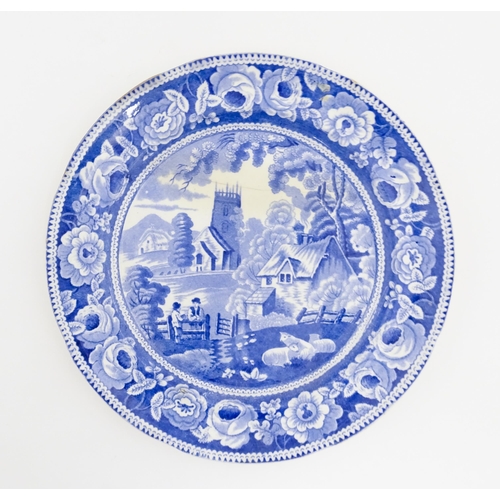 66 - A 19thC blue and white plate decorated in the Village Church pattern with dog rose border. Approx. 9... 