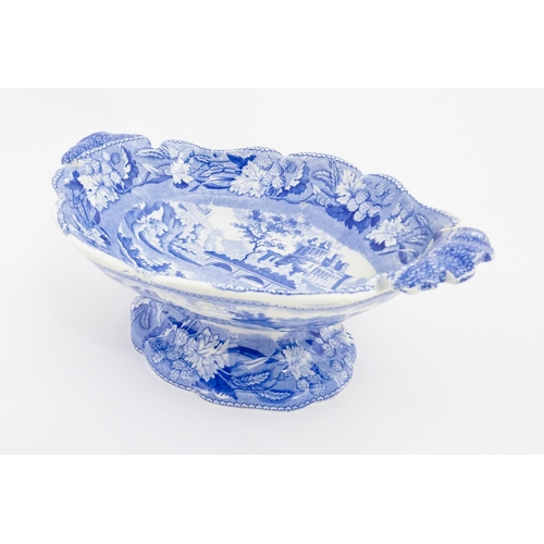 71 - A 19thC Minton blue and white tazza / pedestal dish decorated in the Italian Ruins pattern. Marked u... 