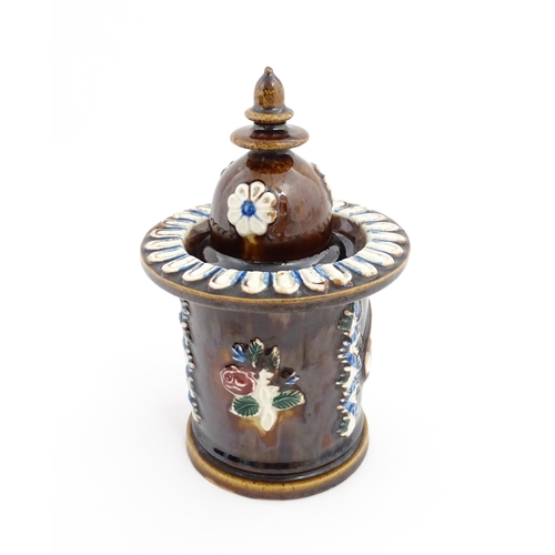 83 - A Victorian Measham bargeware tobacco jar and cover with applied foliate decoration and plaque inscr... 