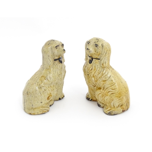 87 - A pair of Staffordshire pottery seated dogs with padlock detail to collars. Approx. 5 3/4