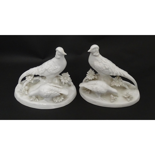 92 - A pair of Crown Staffordshire white glazed bird groups modelled as pheasants by J. T. Jones Approx. ... 