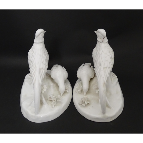 92 - A pair of Crown Staffordshire white glazed bird groups modelled as pheasants by J. T. Jones Approx. ... 