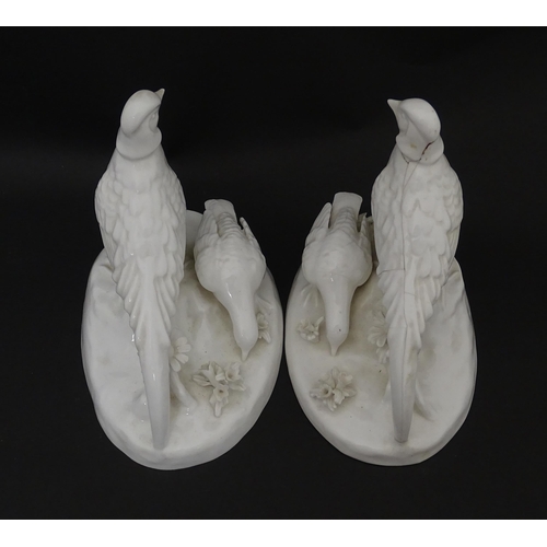 92 - A pair of Crown Staffordshire white glazed bird groups modelled as pheasants by J. T. Jones Approx. ... 