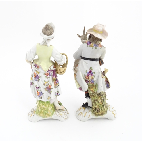 97 - Two Continental porcelain figures modelled as a travelling musician and companion, the male figure h... 