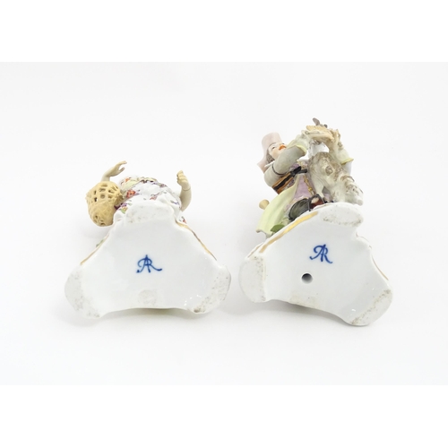 97 - Two Continental porcelain figures modelled as a travelling musician and companion, the male figure h... 