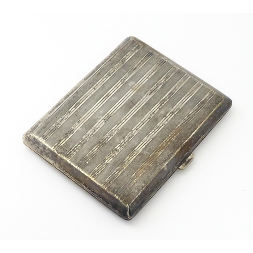 254 - A Continental .935 silver cigarette case with engine turned decoration and gilded interior. Approx. ... 