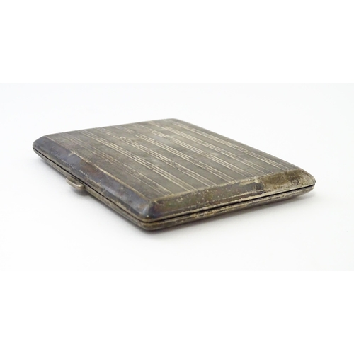 254 - A Continental .935 silver cigarette case with engine turned decoration and gilded interior. Approx. ... 