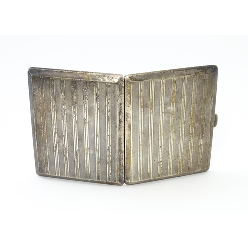 254 - A Continental .935 silver cigarette case with engine turned decoration and gilded interior. Approx. ... 