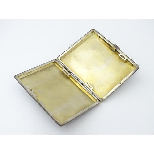 254 - A Continental .935 silver cigarette case with engine turned decoration and gilded interior. Approx. ... 