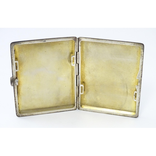 254 - A Continental .935 silver cigarette case with engine turned decoration and gilded interior. Approx. ... 