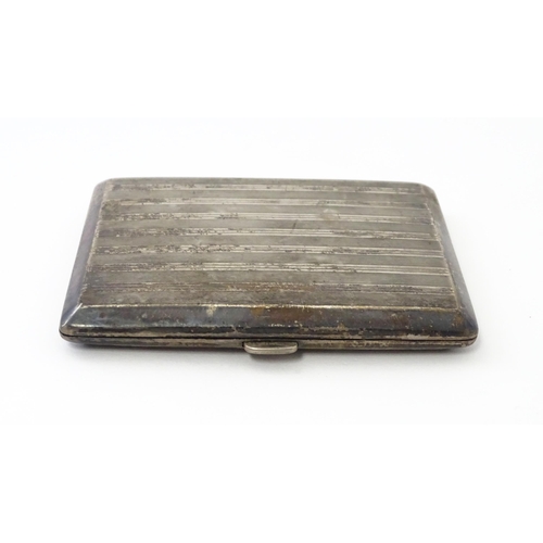 254 - A Continental .935 silver cigarette case with engine turned decoration and gilded interior. Approx. ... 