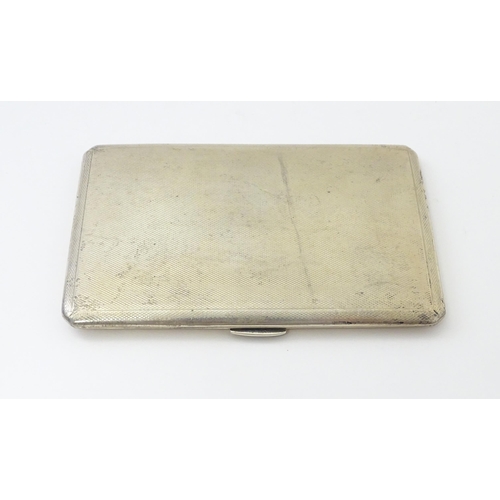 272 - An Art Deco silver cigarette case with engine turned decoration. Hallmarked Birmingham 1945 maker D.... 