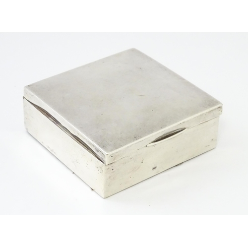 293 - A silver cigarette box hallmarked Birmingham 1921, maker I S Greenberg & Co. Approx. 3 1/4