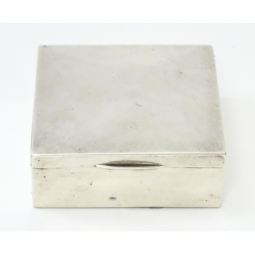 293 - A silver cigarette box hallmarked Birmingham 1921, maker I S Greenberg & Co. Approx. 3 1/4